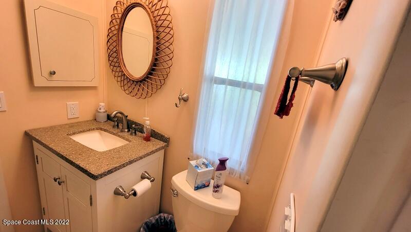 926 Yew Street Sebastian, FL 32976 - Photo 18 of 36 a bathroom with a sink and a mirror
