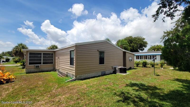 926 Yew Street Sebastian, FL 32976 - Photo 24 of 36 a view of a house with a yard and chairs