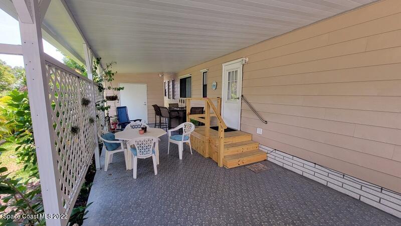 926 Yew Street Sebastian, FL 32976 - Photo 3 of 36 a balcony with furniture and a potted plant