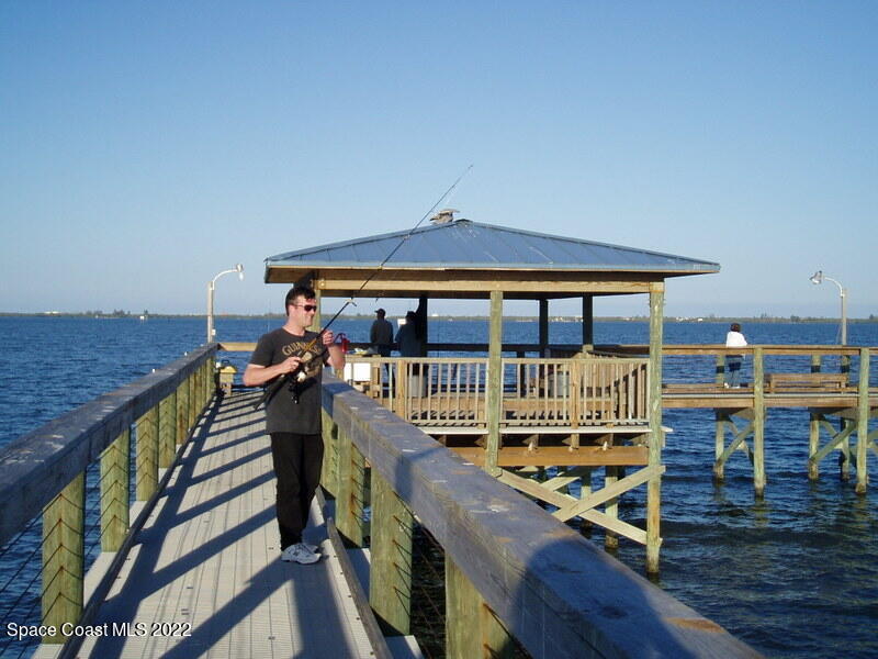 926 Yew Street Sebastian, FL 32976 - Photo 31 of 36 a view of balcony with wooden floor and fence