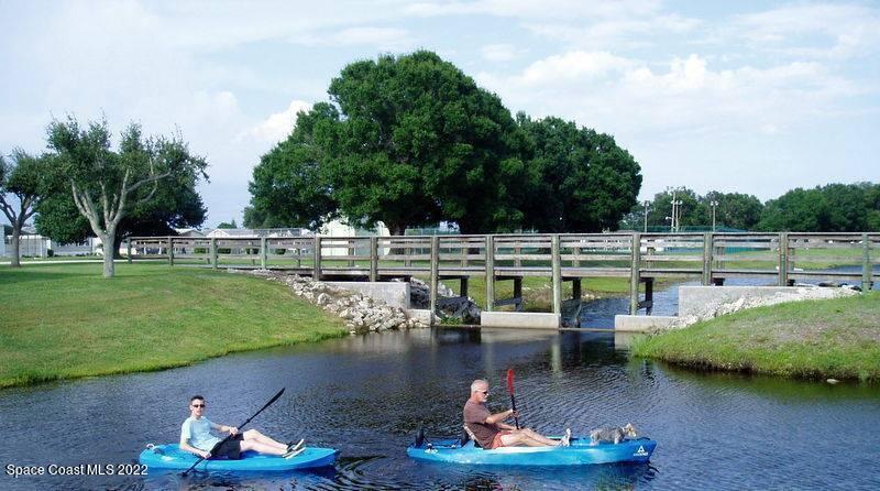 926 Yew Street Sebastian, FL 32976 - Photo 35 of 36 a swimming pool with outdoor seating and green space