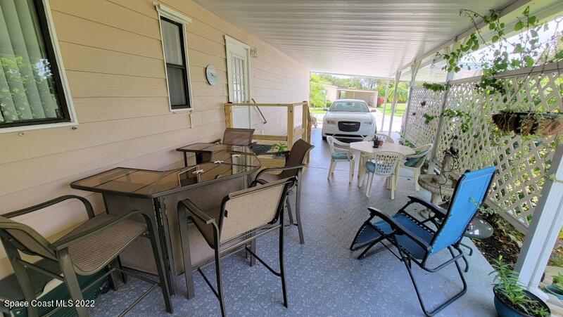 926 Yew Street Sebastian, FL 32976 - Photo 4 of 36 a view of a dining room with furniture window and outside view