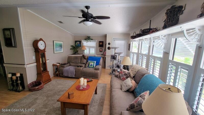 926 Yew Street Sebastian, FL 32976 - Photo 6 of 36 a living room with furniture and a window