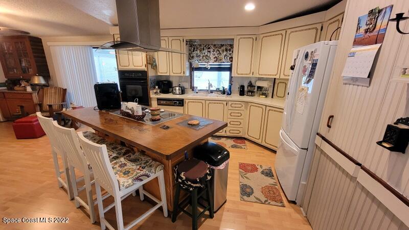 926 Yew Street Sebastian, FL 32976 - Photo 8 of 36 a view of a kitchen with furniture and a window