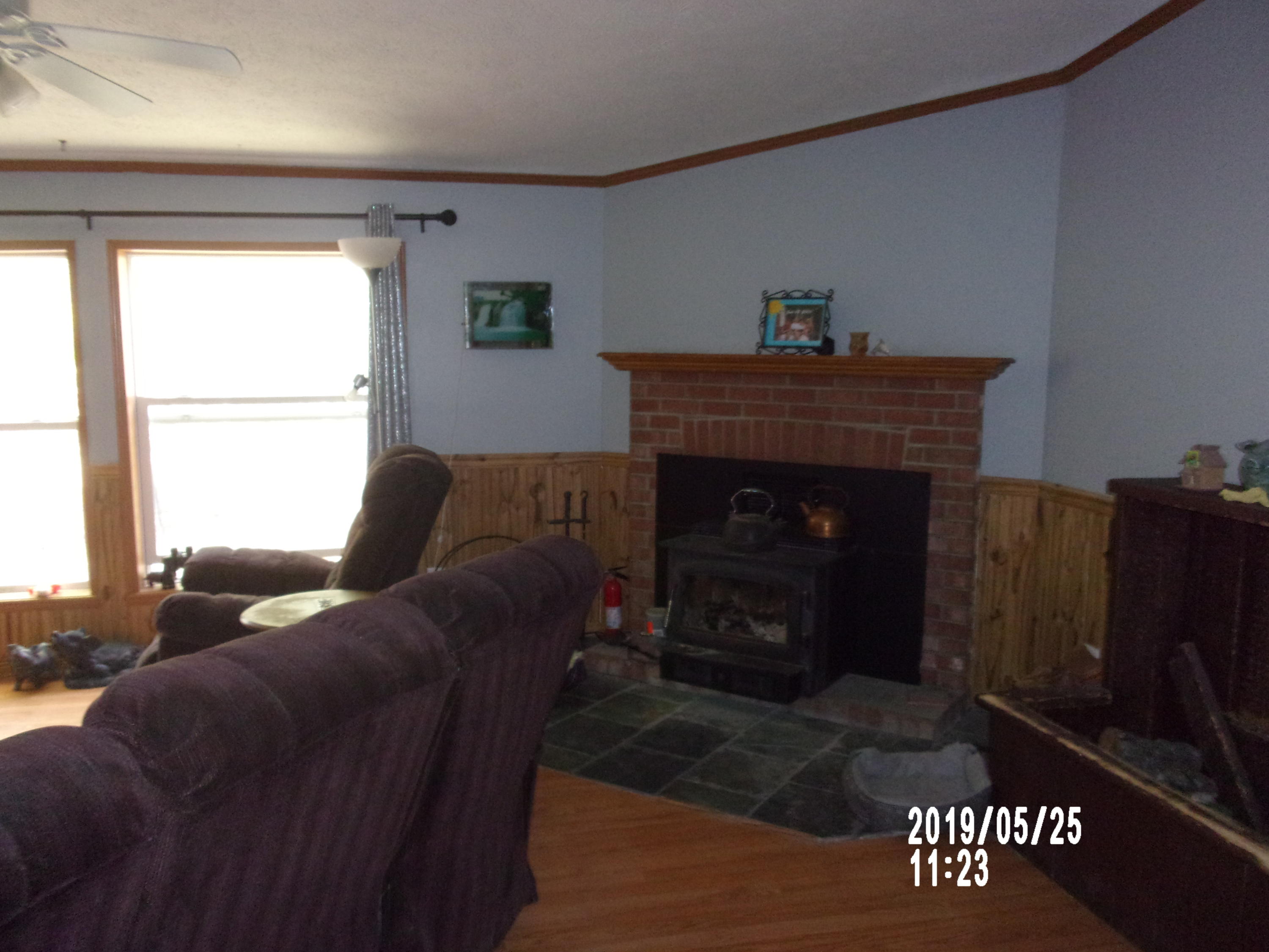 74 Guilford Center Road Guilford, ME 04443 - Photo 11 of 32 fireplace in living room