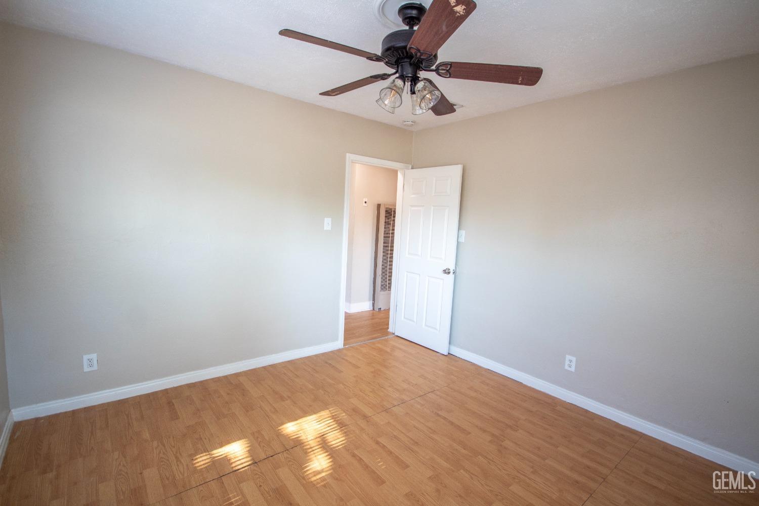 Undisclosed Address Bakersfield, CA 93305 - Photo 14 of 20 a view of a big room with a ceiling fan and a chandelier fan