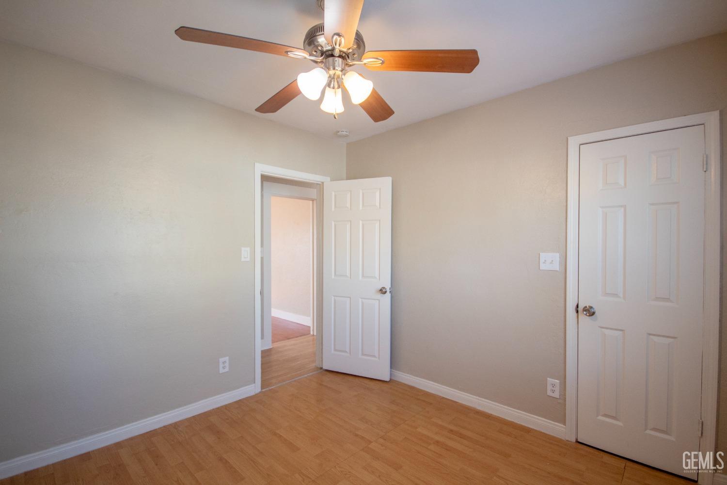 Undisclosed Address Bakersfield, CA 93305 - Photo 16 of 20 an empty room with closet and fan