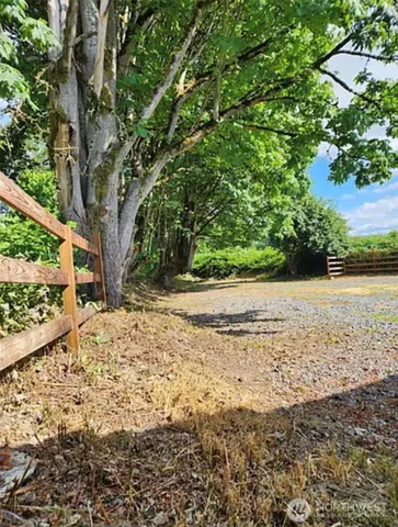 a view of a lake with a yard