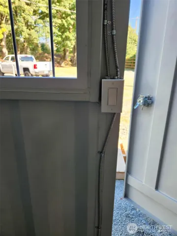 a view of a porch with wooden floor and a yard