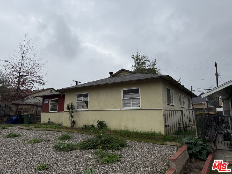 8230 Kyle Street Sunland, CA 91040 - Photo 2 of 13 a front view of a house with garden