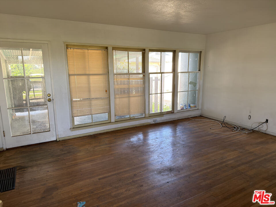 8230 Kyle Street Sunland, CA 91040 - Photo 7 of 13 wooden floor in an empty room with a window