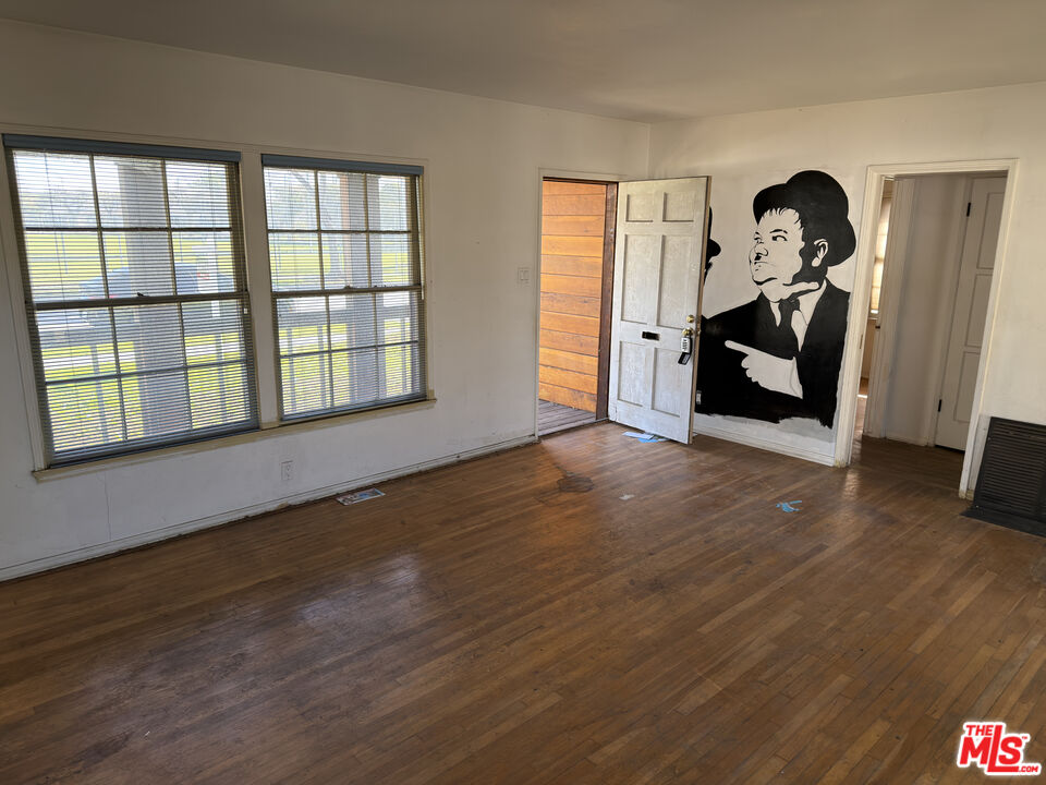8230 Kyle Street Sunland, CA 91040 - Photo 8 of 13 a view of empty room with wooden floor