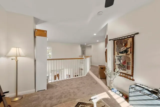 a view of a livingroom with furniture and windows