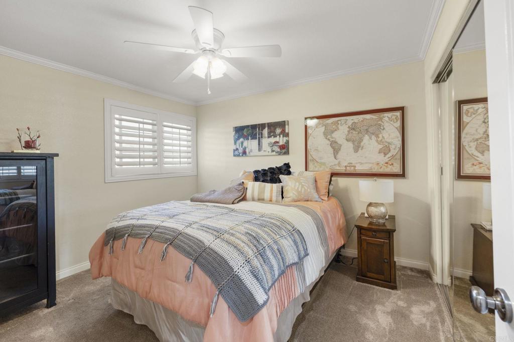 3033 Rancho La Presa Carlsbad, CA 92009 - Photo 22 of 46 a bedroom with a bed and a tv