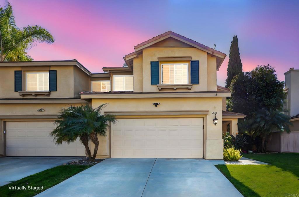 3033 Rancho La Presa Carlsbad, CA 92009 - Photo 3 of 46 a front view of a house with a yard and garage