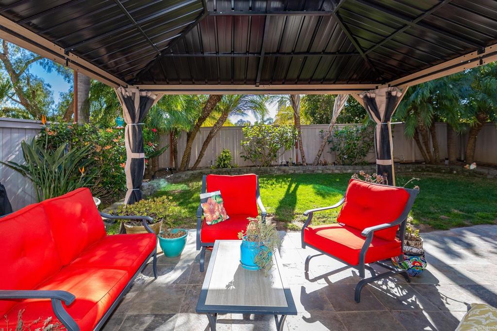 3033 Rancho La Presa Carlsbad, CA 92009 - Photo 32 of 46 a backyard of a house with a table and chairs