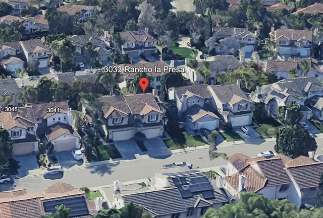 an aerial view of a houses with outdoor space