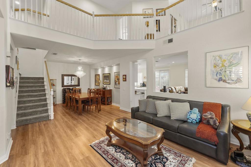 3033 Rancho La Presa Carlsbad, CA 92009 - Photo 6 of 46 a living room with furniture and wooden floor