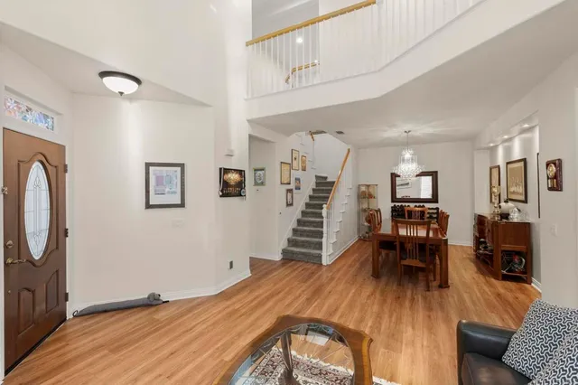 a livingroom with furniture wooden floor and a window