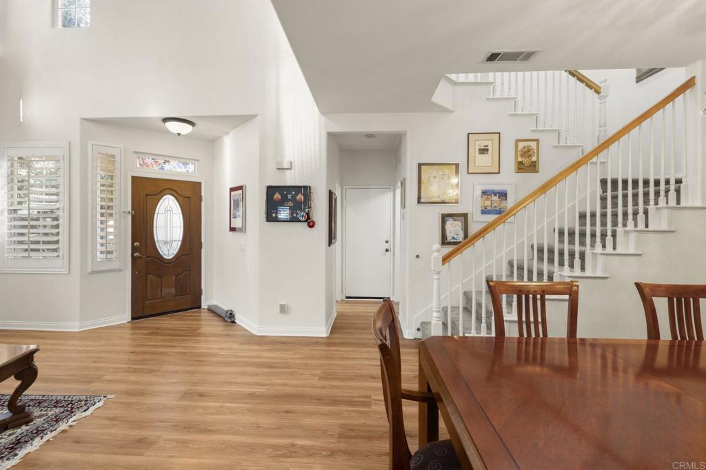 3033 Rancho La Presa Carlsbad, CA 92009 - Photo 10 of 46 a view of a hallway with wooden floor and entryway