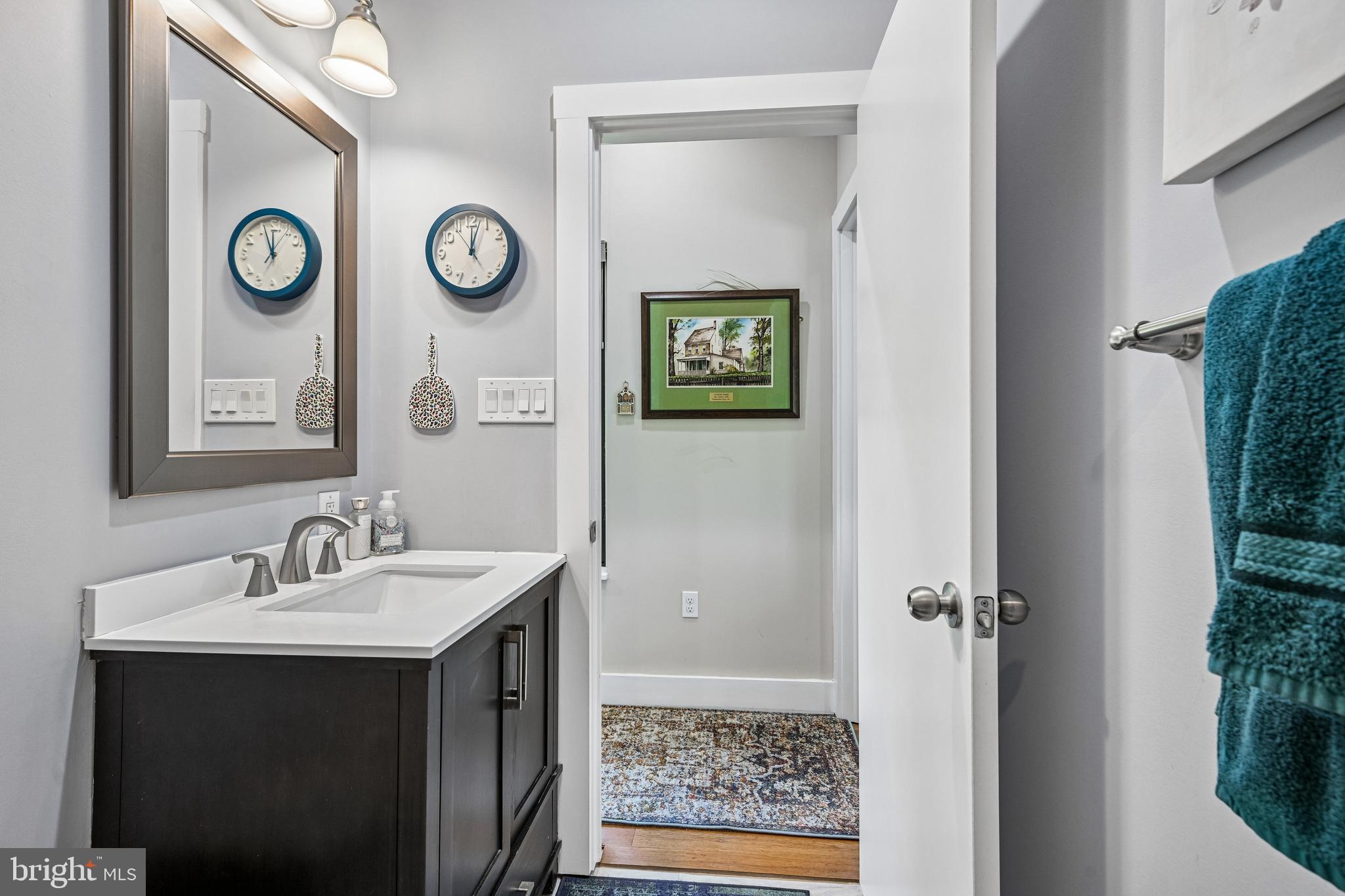 11 Forklanding Road Cinnaminson, NJ 08077 - Photo 25 of 77 a bathroom with a sink and a mirror