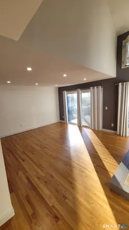 a view of an empty room with glass door