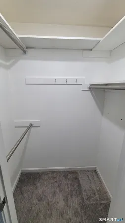 a view of an empty walk in closet
