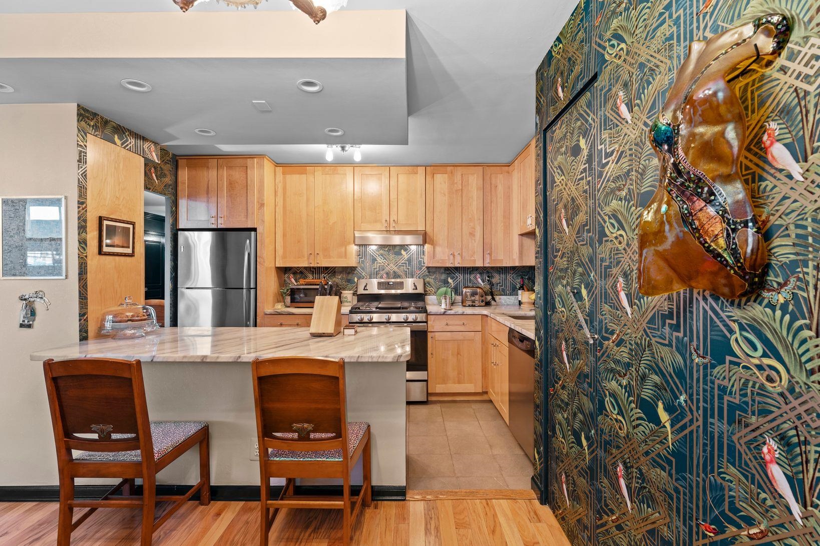 6040 Boulevard East, Unit MA West New York, NJ 07093 - Photo 14 of 35 a kitchen with stainless steel appliances granite countertop a stove a sink and a refrigerator
