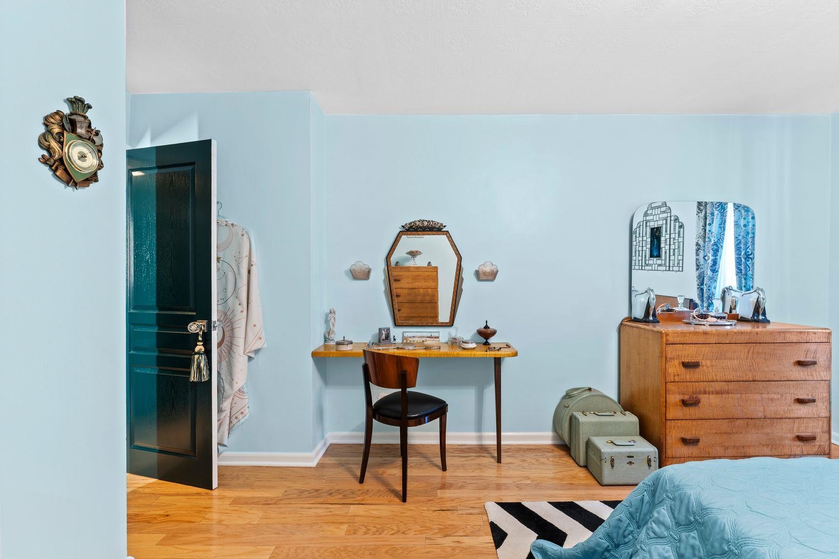 6040 Boulevard East, Unit MA West New York, NJ 07093 - Photo 19 of 35 a room with a table chairs and a bed