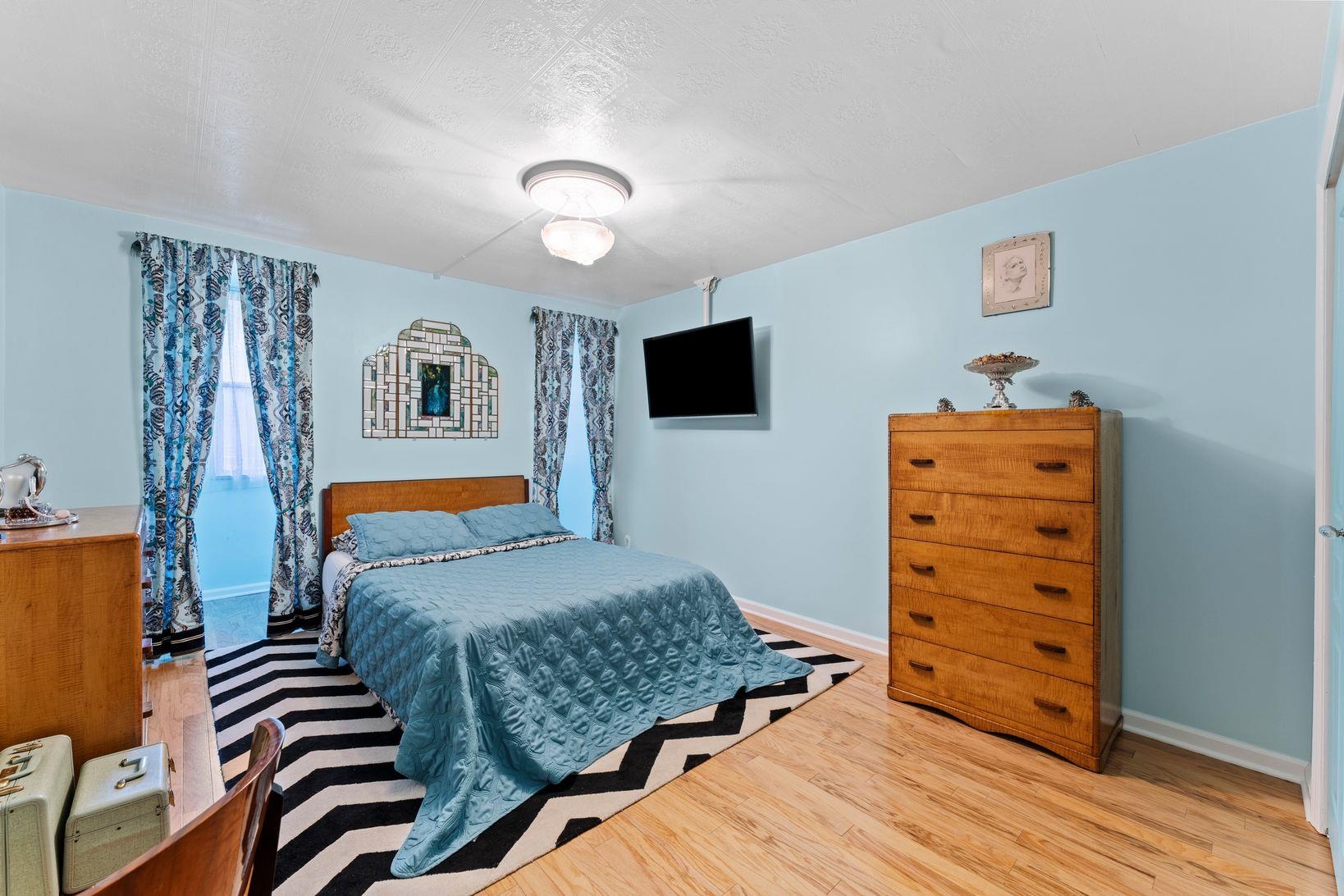 6040 Boulevard East, Unit MA West New York, NJ 07093 - Photo 21 of 35 a bedroom with a bed and furniture