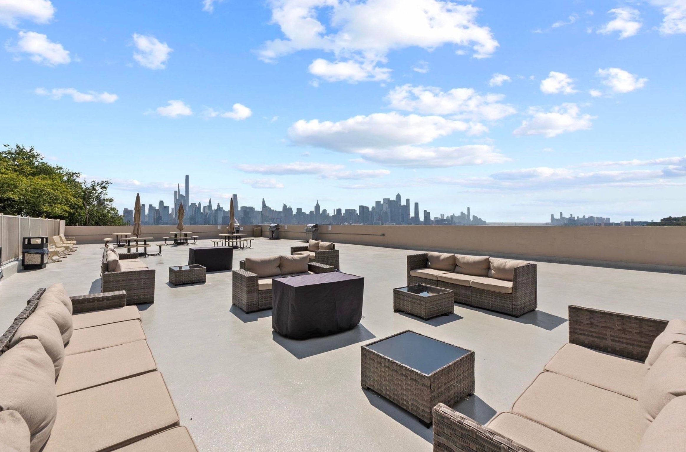 6040 Boulevard East, Unit MA West New York, NJ 07093 - Photo 34 of 35 a view of a roof deck with couches and potted plants