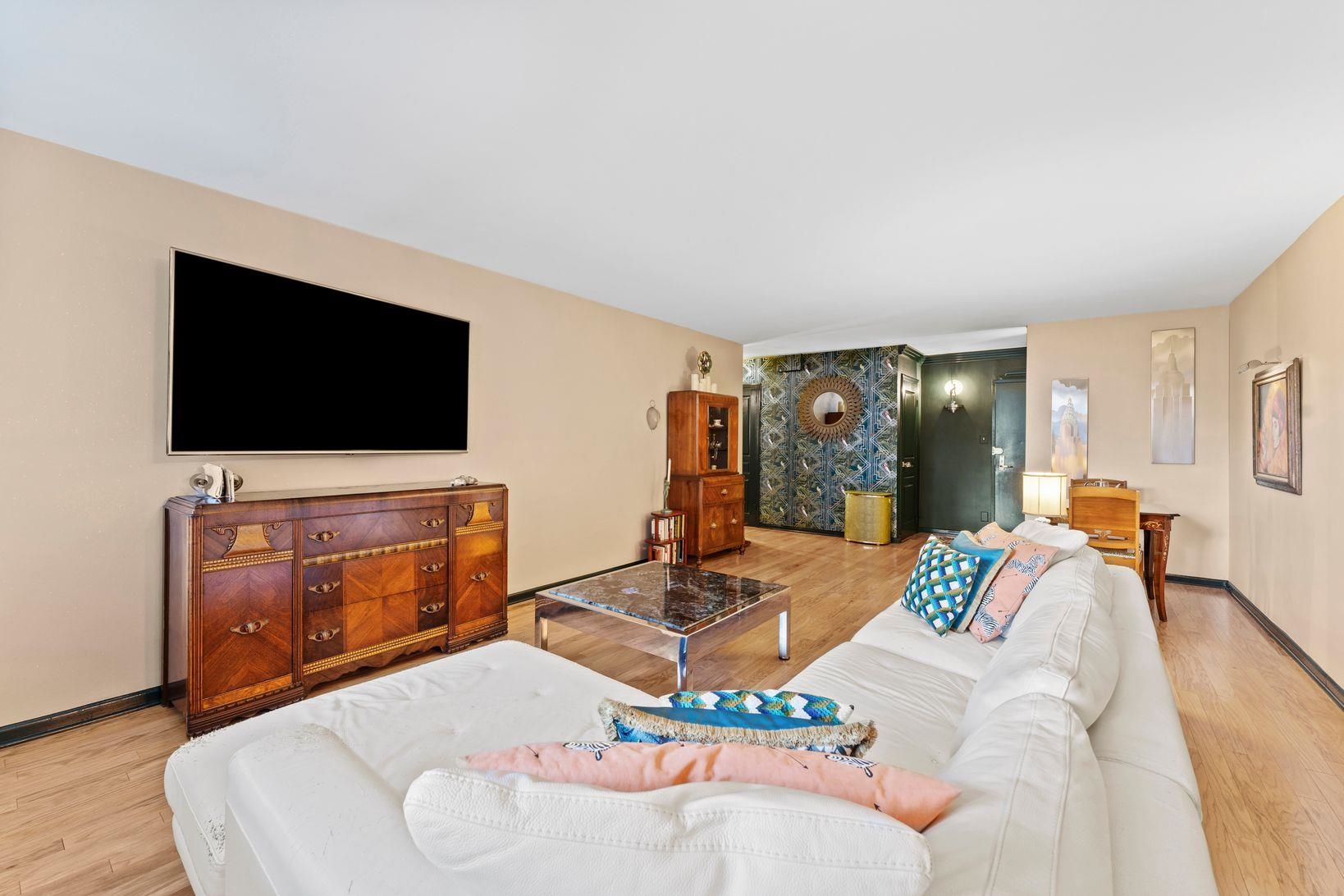 6040 Boulevard East, Unit MA West New York, NJ 07093 - Photo 7 of 35 a living room with furniture and a flat screen tv
