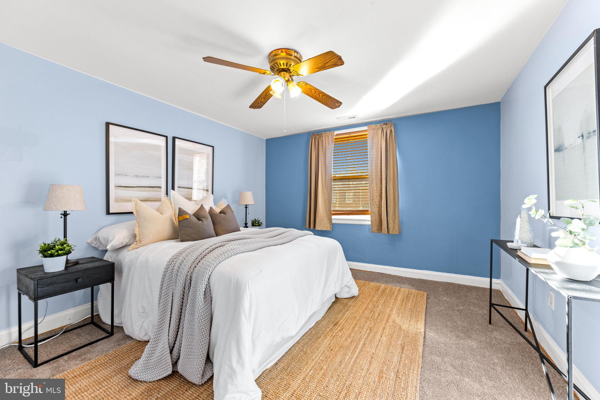 3807 Kimble Road Baltimore, MD 21218 - Photo 17 of 39 a bedroom with a bed and a window