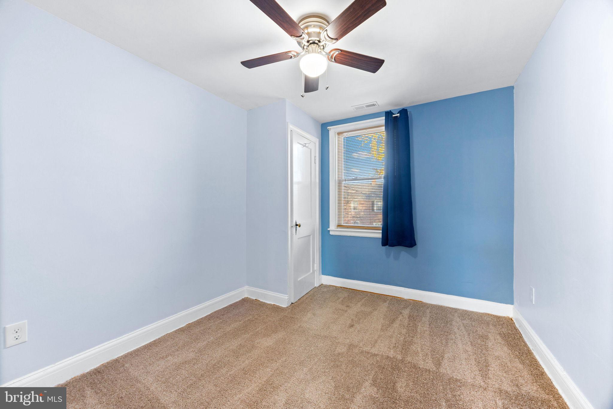 3807 Kimble Road Baltimore, MD 21218 - Photo 21 of 39 an empty room with closet and a ceiling fan