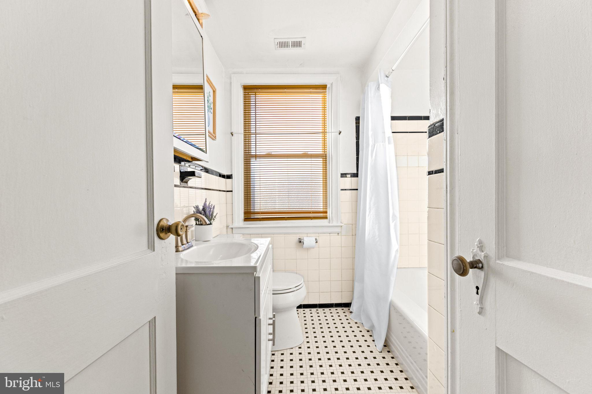 3807 Kimble Road Baltimore, MD 21218 - Photo 24 of 39 a bathroom with a sink a toilet and shower