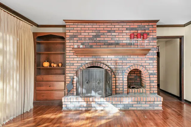 a view of fireplace and wooden floor