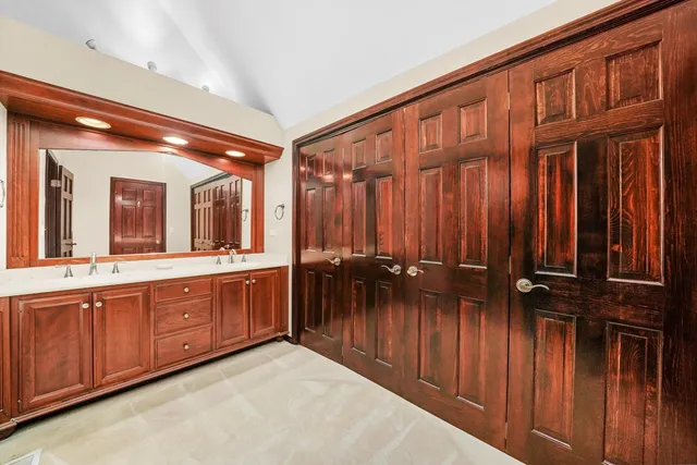 a bathroom with a sink and a large mirror