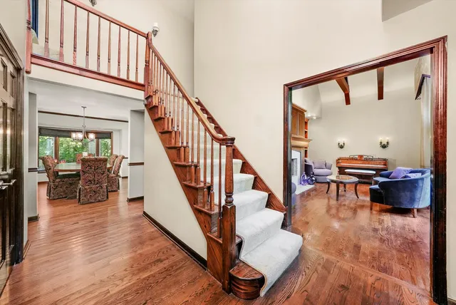a view of entryway dining room and hall with wooden floor