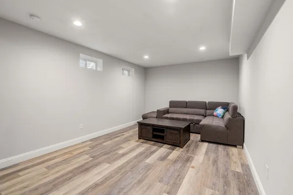 a room with furniture and a wooden floor