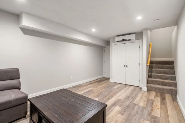 a view of livingroom with hardwood floor and hallway