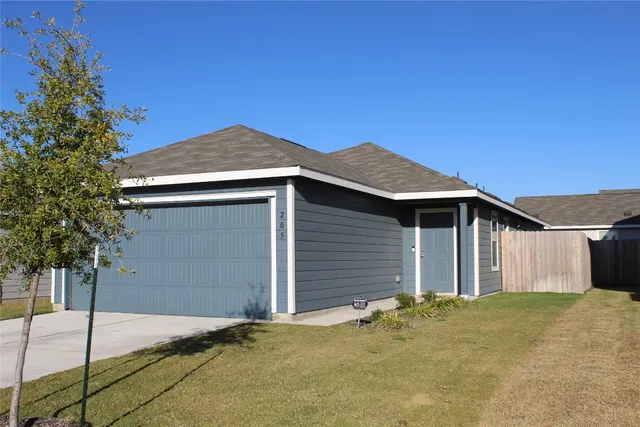 a front view of a house with a garage