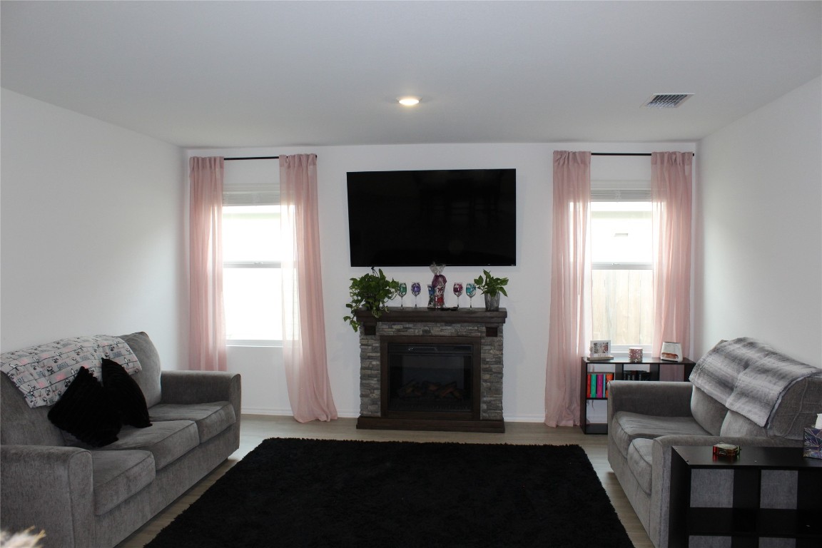 205 Marty Allen Loop Jarrell, TX 76537 - Photo 3 of 22 a living room with furniture and a flat screen tv