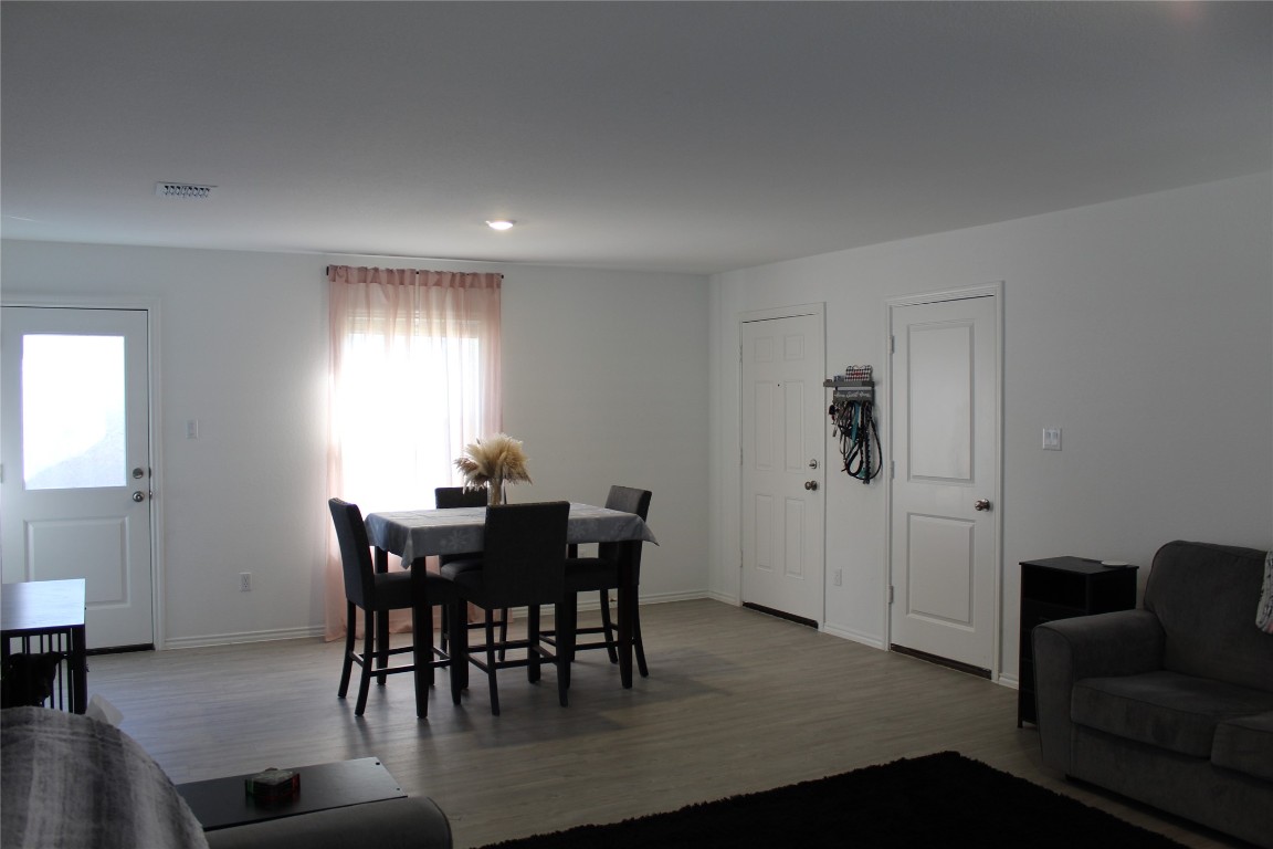 205 Marty Allen Loop Jarrell, TX 76537 - Photo 8 of 22 a view of a dining room with furniture and window