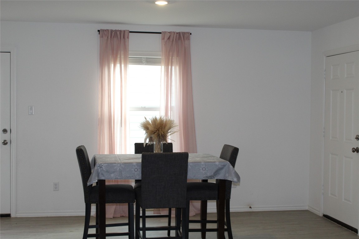 205 Marty Allen Loop Jarrell, TX 76537 - Photo 9 of 22 a view of a dining room with furniture and a potted plant