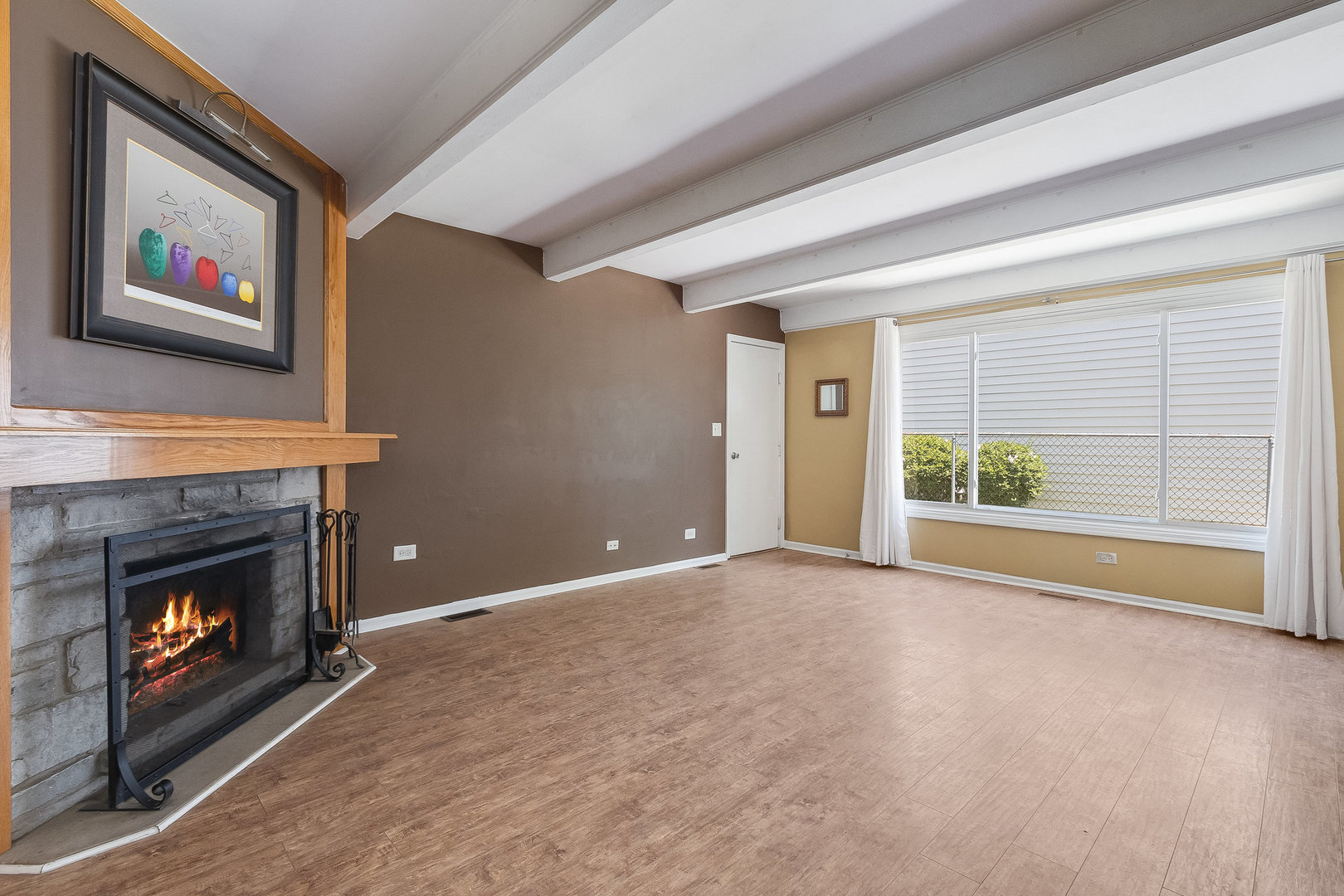 429 West Briarcliff Road Bolingbrook, IL 60440 - Photo 11 of 25 a view of an empty room with furniture and a fireplace