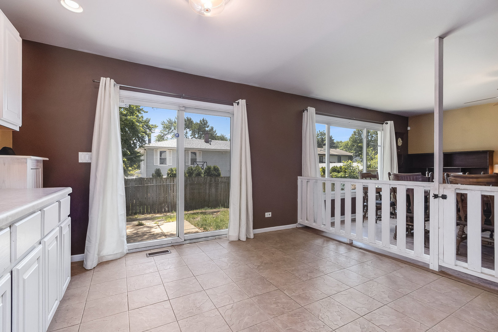 429 West Briarcliff Road Bolingbrook, IL 60440 - Photo 5 of 25 a view of a big room with windows and entryway