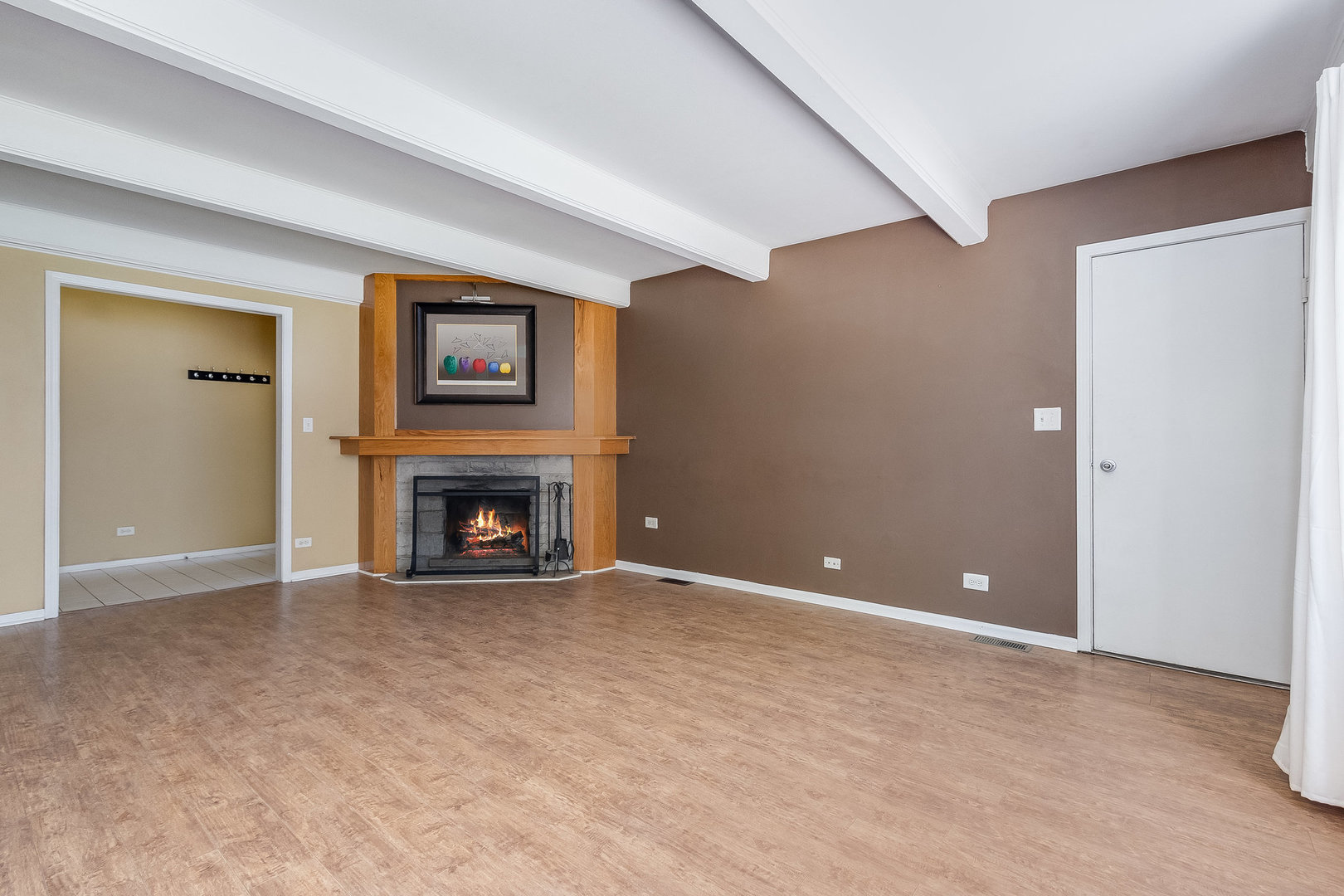 429 West Briarcliff Road Bolingbrook, IL 60440 - Photo 10 of 25 a view of an empty room with a fireplace