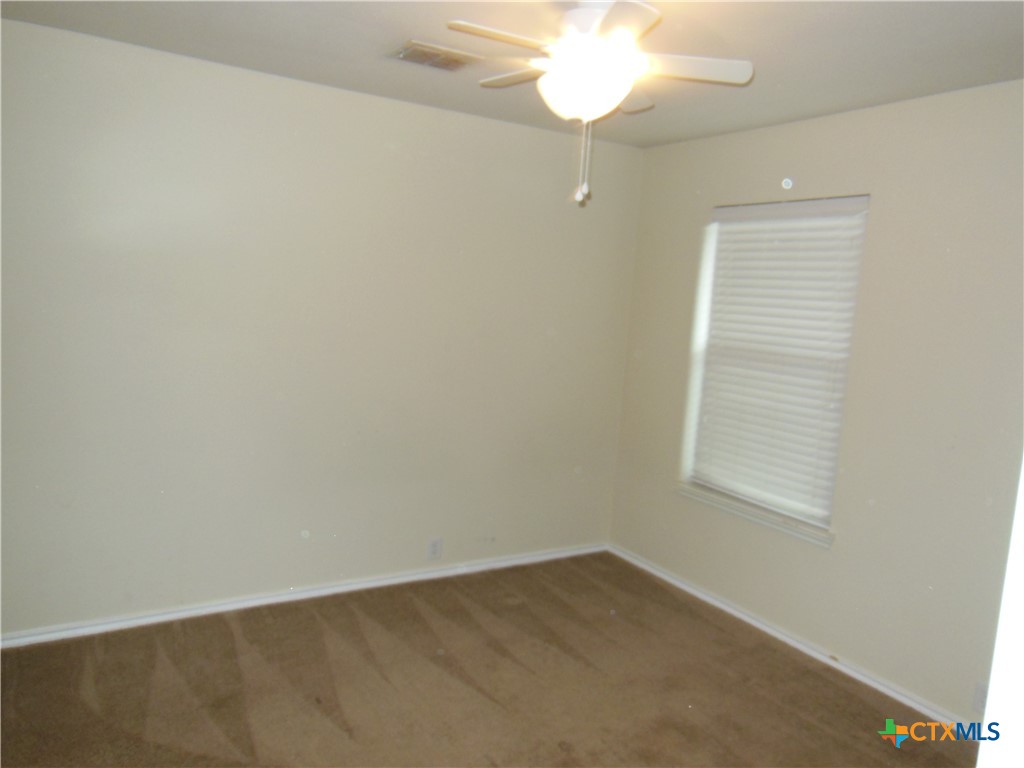 5244 Brookline Schertz, TX 78108 - Photo 15 of 24 an empty room with a chandelier fan