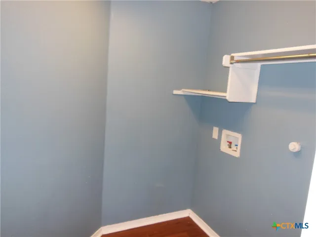 a view of a backyard with large trees