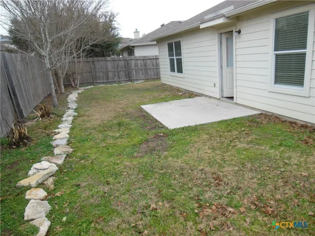 a view of a playground with a yard